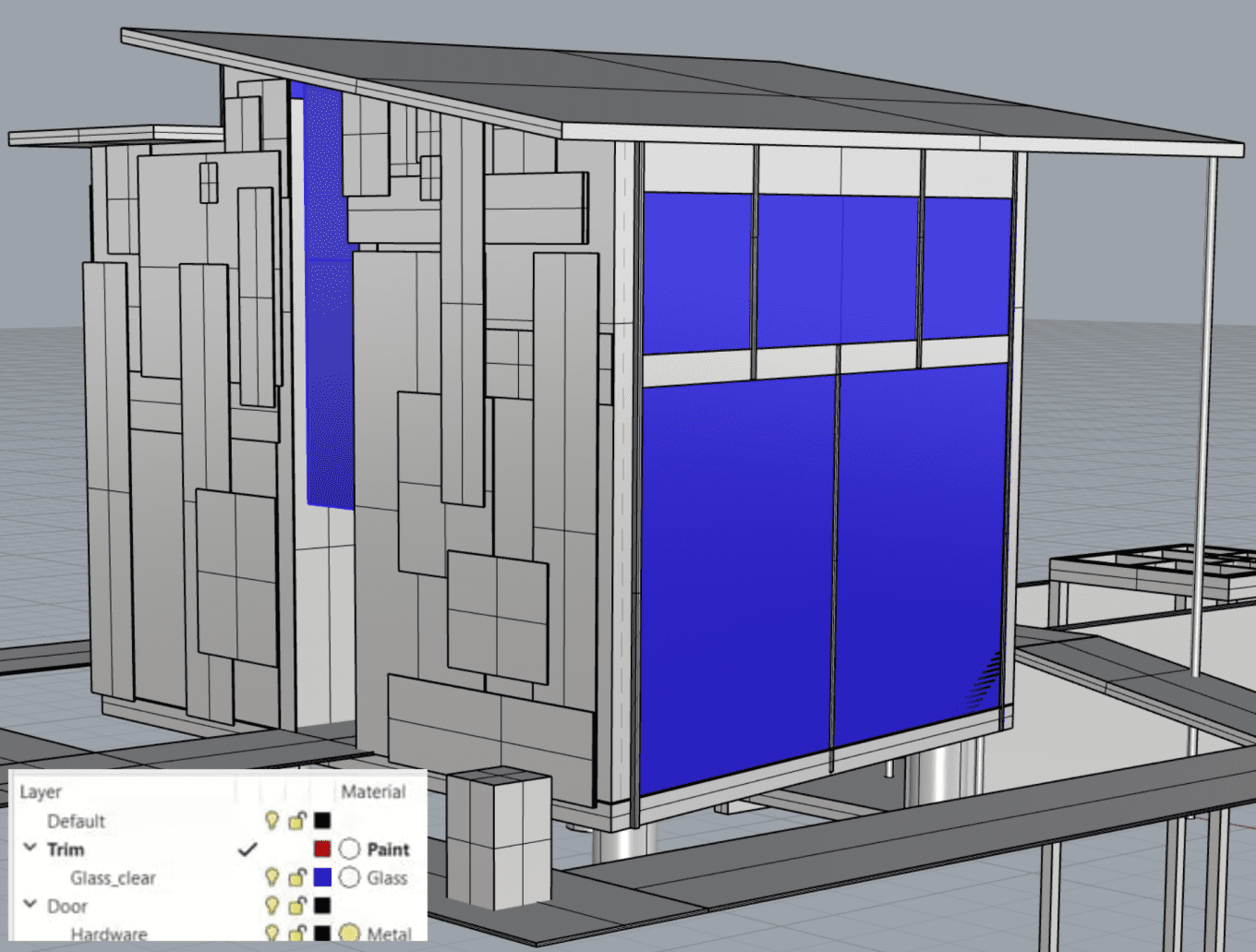 a wireframe model of the pavilion, its windows are highlighted in blue demonstrating how different layers were selected to alter their material appearing in later steps